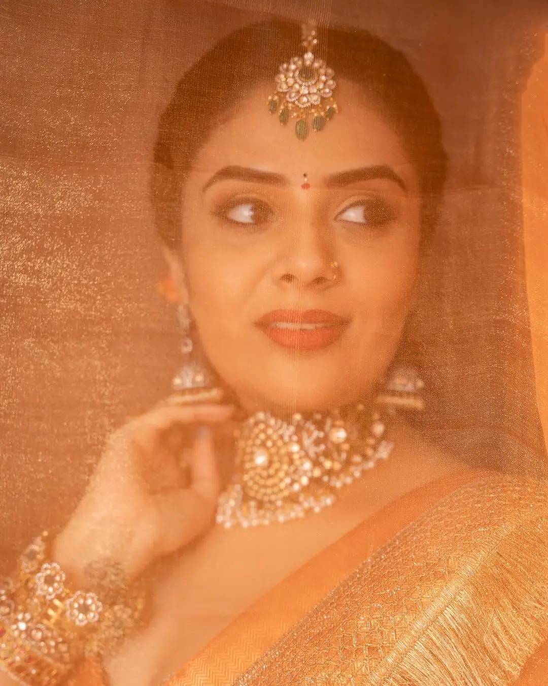 ETV Actress Sreemukhi in Orange Lehenga Blue Choli